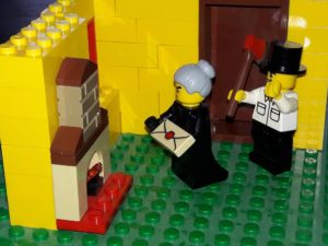 Lego minifigure old lady in a Lego room holding a package, Lego minifigure man holding axe behind her